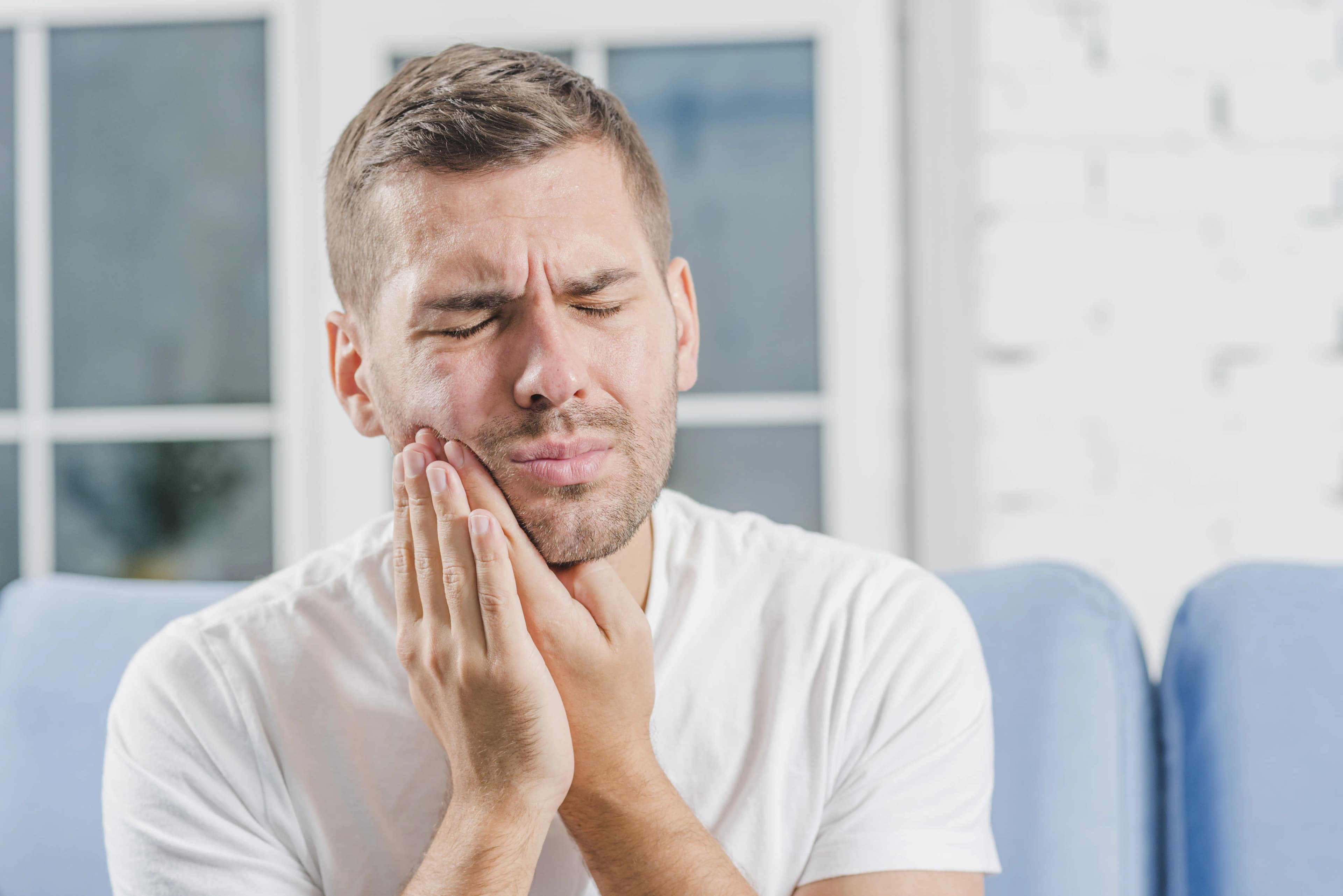 Dentist performing a wisdom tooth extraction in Banff